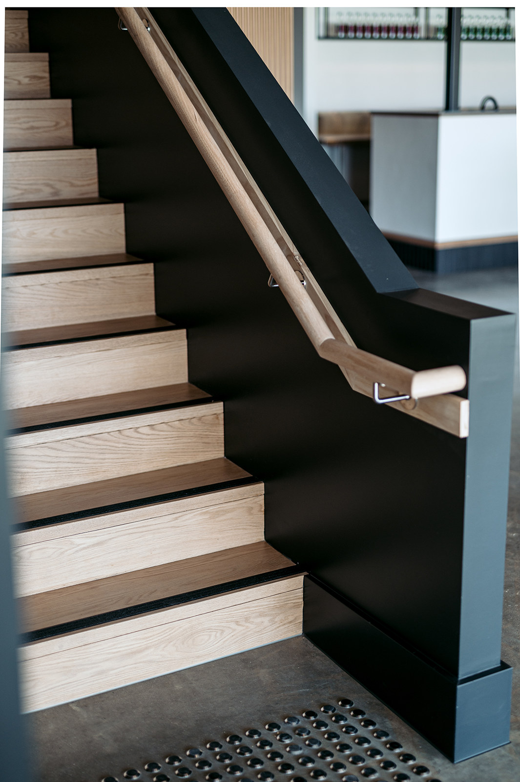 Detail of timber stair treads against a dark stringer