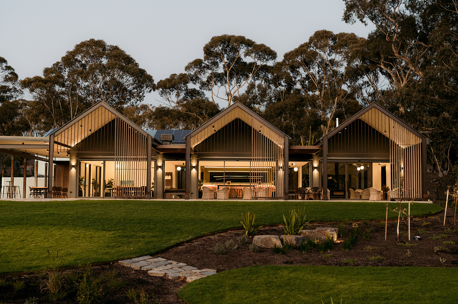 Coastal Retreat Study, row of timber-battened gables among gum trees